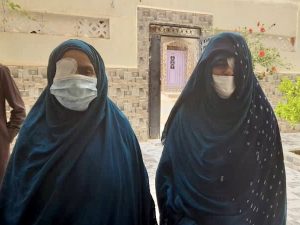 Two women with blindfolded eye after surgery Two women with blindfolded eye after surgery