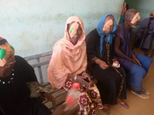 Group of women with a covered eye after the eye procedure Group of women with a covered eye after the eye procedure